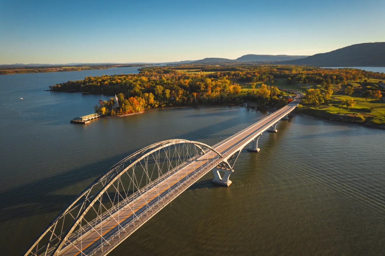 fall scene across lake champlain bridge