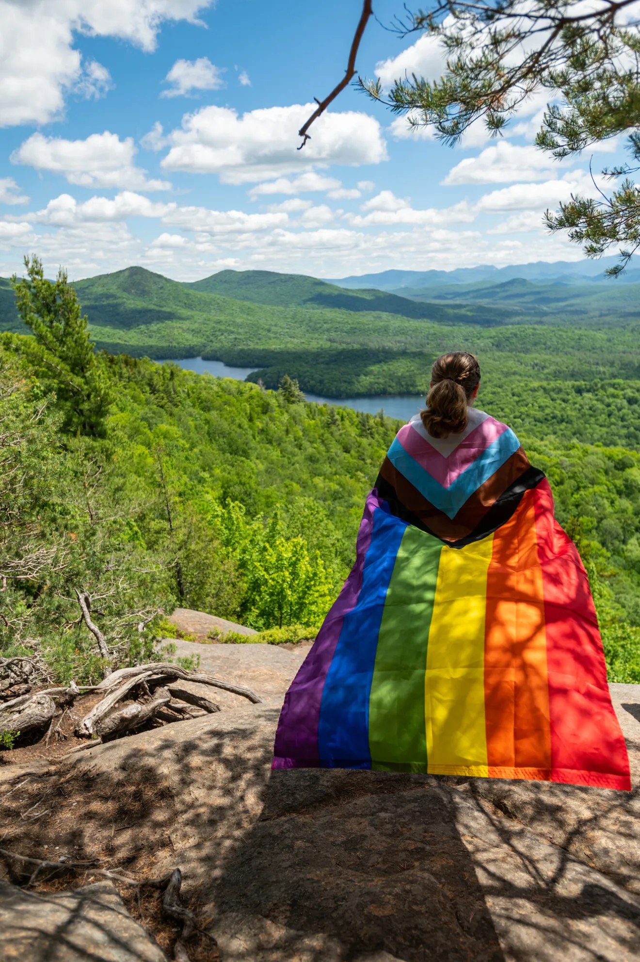 woman with flag looking out at the view