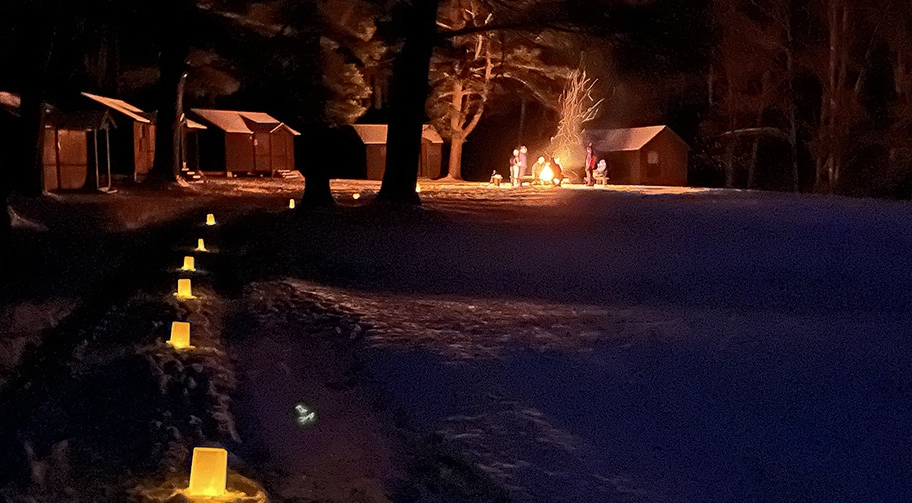Twin Valleys Outdoor Education Center at night lit up by luminaria