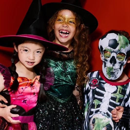 3 children in halloween costumes