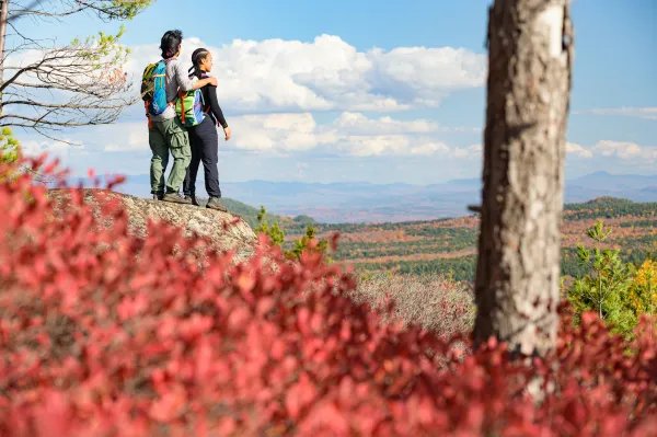 A couple looking out at the views from Treadway Mountain.