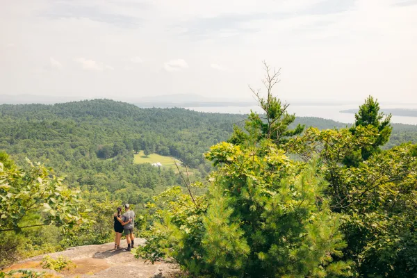 Two people on the summit of Coon Mountain