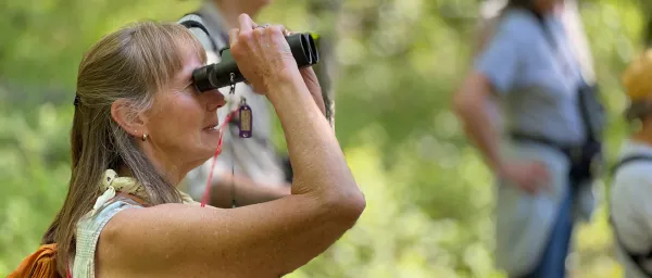 woman using field glasses