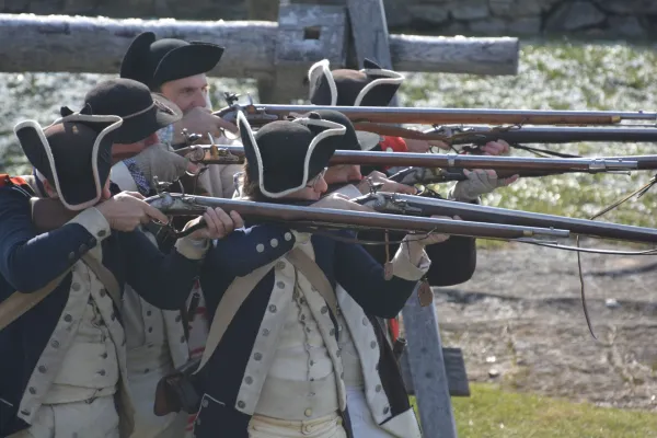 uniformed soldiers with long rifles