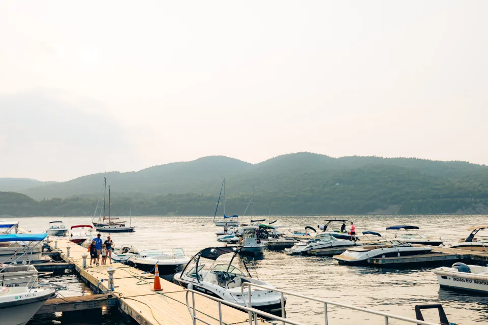 A marina on a lake filled with boats.