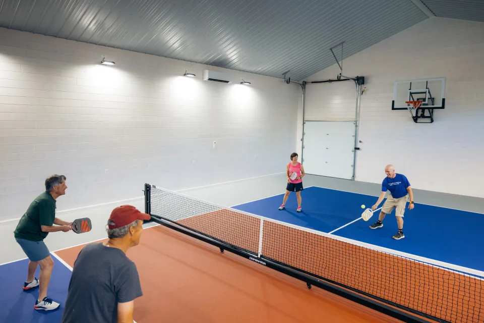 People playing on a pickleball court.
